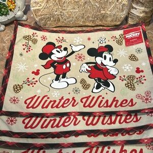 Disney Winter Wishes set of four Mickey and Minnie Mouse placemat.